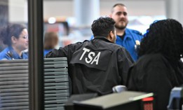 Transportation Security Administration workers at the security checkpoint at Albany International Airport on March 23. The agency said that requiring workers to stand at travel document check stations “reinforces both our security posture and our commitment to hospitality.”