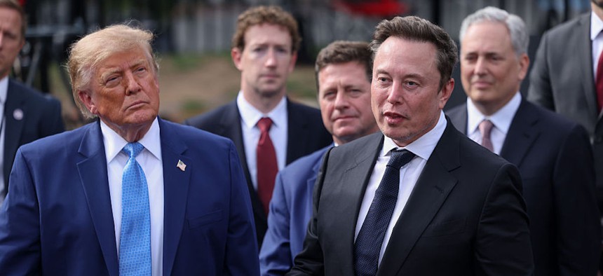 Tesla, X and SpaceX CEO Elon Musk speaks to reporters as President Donald Trump looks on outside the White House on Sept. 29, 2026. Trump held a meeting earlier that day on "super intelligence" with tech CEOs in the East Room.