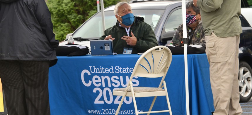 Census Bureau employees hold an event in Albany, N.Y., on Oct. 2, 2020, to get people to complete their census forms. The COVID-19 pandemic significantly impacted 2020 census operations.