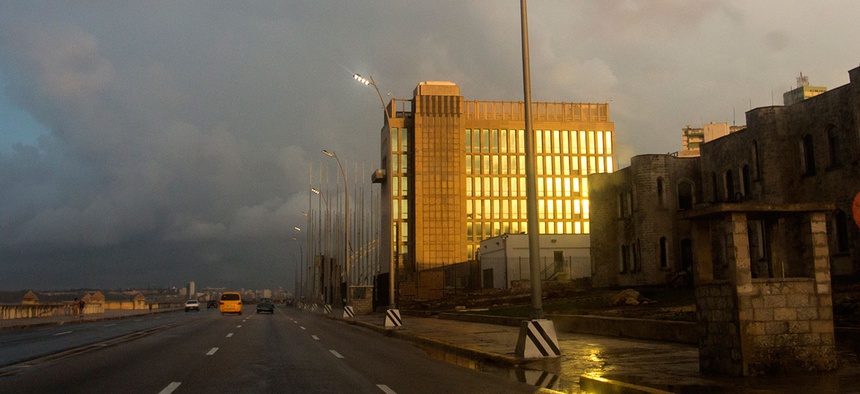 Rays from the setting sun shine on the facade of the United States Embassy, in Havana in October.