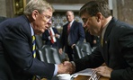 Robert Wilkie, right, shakes hands with Senate Veterans Affairs Committee chairman Johnny Isakson, R-Ga., left, after a nomination hearing in June.