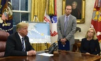 Reporters question FEMA Administrator Brock Long (center) during a briefing on Hurricane Florence Tuesday. 