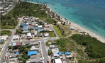 Blue tarps cover homes in Puerto Rico that were still damaged nine months after Hurricane Maria hit. 