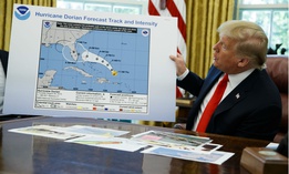 President Trump holds up a chart of Hurricane Dorian's projected path during a briefing on Sept. 4. 