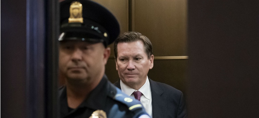 Michael Atkinson, the inspector general of the intelligence community, steps into an elevator as he leaves a secure area in the Capitol after a day of questions about the whistleblower complaint that led to the impeachment hearings.