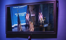 President-elect Joe Biden, accompanied by Vice President-elect Kamala Harris, shown reflected in a mirror, speaks in Delaware on Monday.