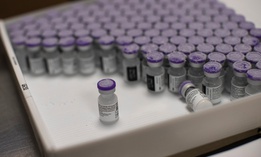 Frozen vials of the COVID-19 vaccine are taken to be defrosted and ready to be usable, at the MontLegia CHC hospital in Liege, Belgium, on Monday. 