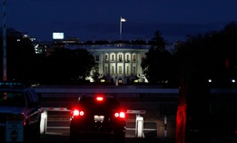 A driver waits to enter at a security checkpoint leading to the White House on Friday, two days after the inauguration of President Joe Biden. 