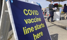 A sign is shown at a COVID-19 vaccine site in the Bayview neighborhood of San Francisco on Feb. 8.